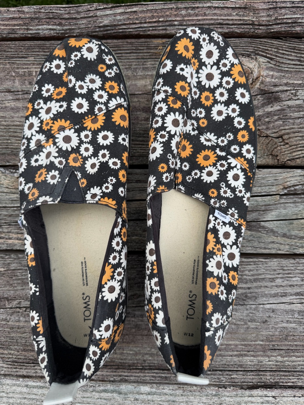 TOMS Black Floral Slip-On Flats with White and Orange Daisies - Women’s 12 Men10